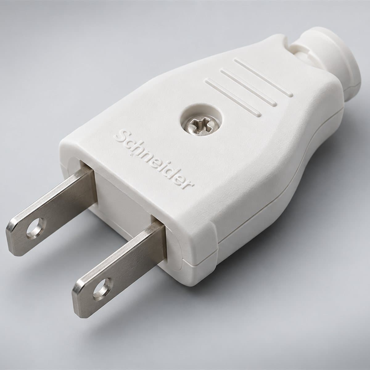 Phích cắm 2 chân dẹt Schneider chụp góc nghiêng 3/4, thấy rõ mặt và cạnh bên
