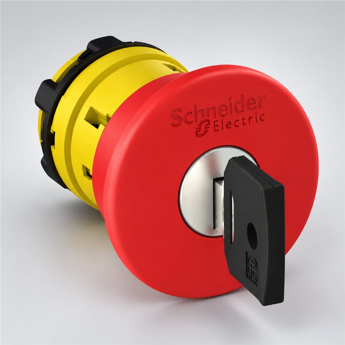 Đầu nút dừng khẩn nhả bằng chìa Harmony XB5 Schneider chụp góc nghiêng 3/4, thấy rõ mặt và cạnh bên