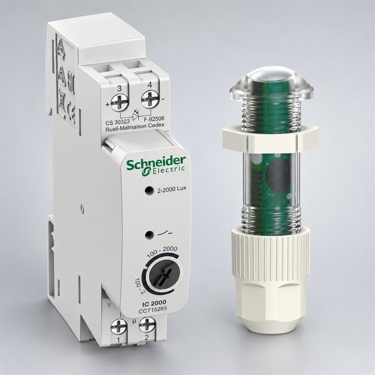 Cảm biến độ sáng gắn tủ điện Schneider chụp góc nghiêng 3/4, thấy rõ mặt và cạnh bên