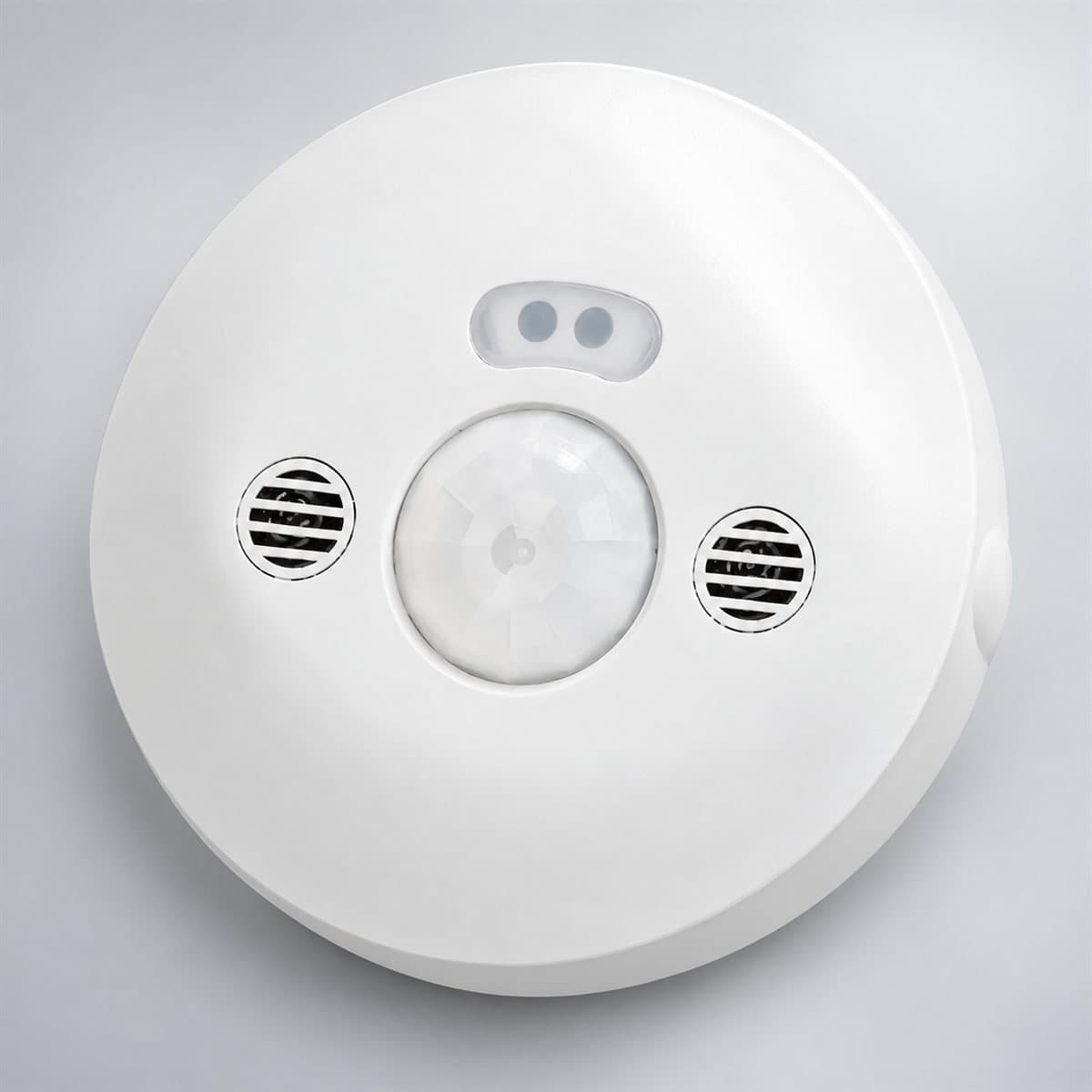 Cảm biến hồng ngoại và siêu âm, gắn trần, góc quét 360 độ Legrand chụp góc nghiêng 3/4, thấy rõ mặt và cạnh bên