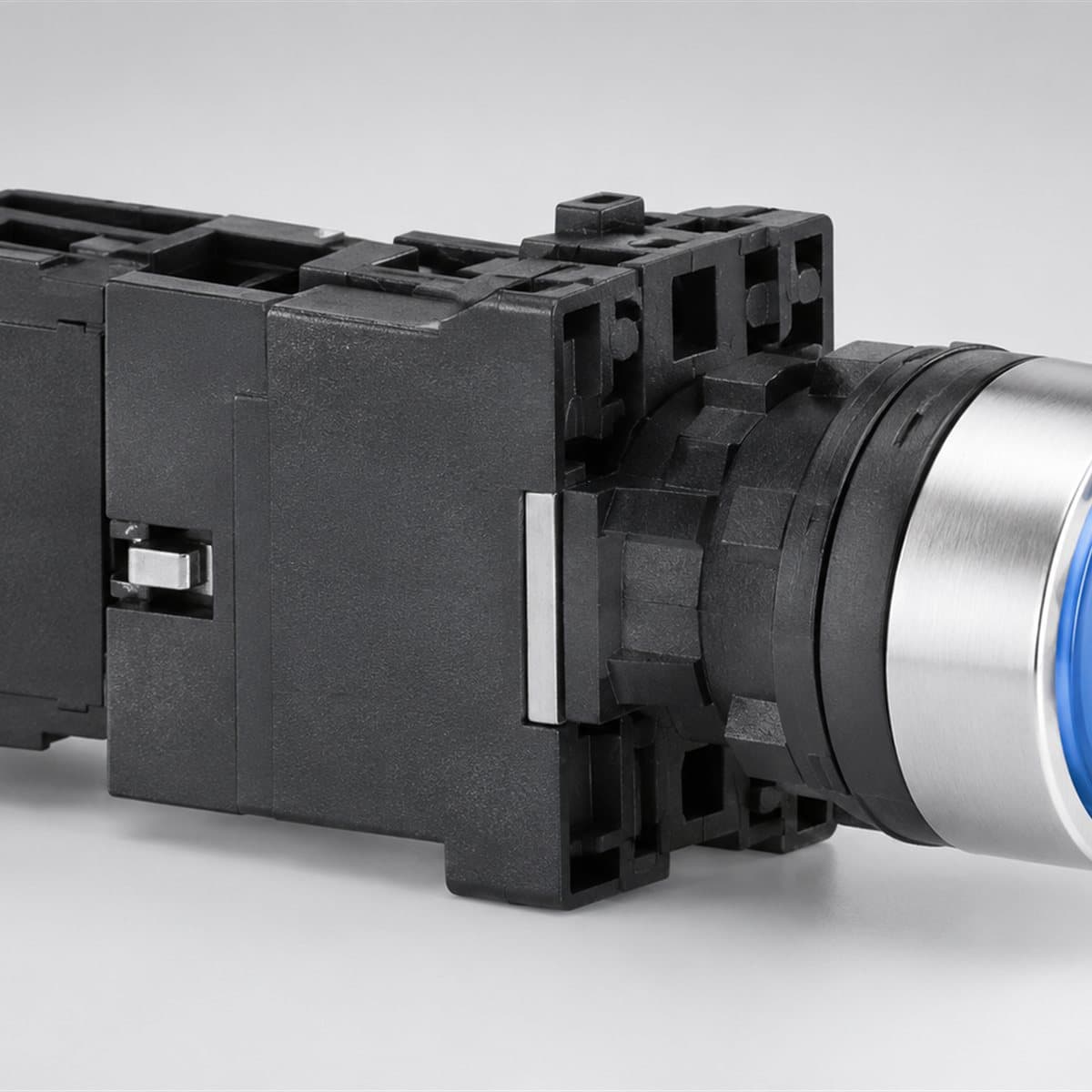 Nút nhấn có đèn Harmony XA2 Ø22 Schneider chụp góc nghiêng 3/4, thấy rõ mặt và cạnh bên